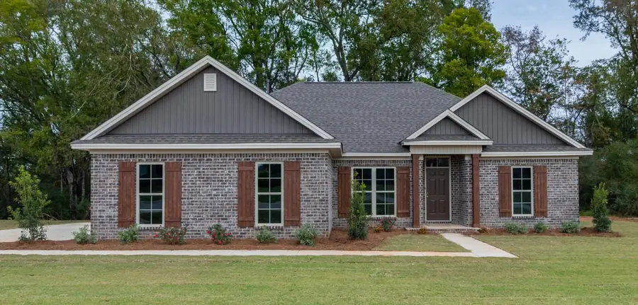 Long brick home with gray board-and-batten gables, shutters and a covered front entry